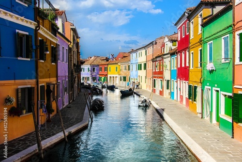 Canal surrounded by colorful buildings in Murano