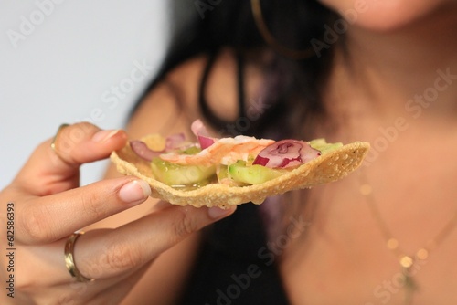 Female holding a guacamole