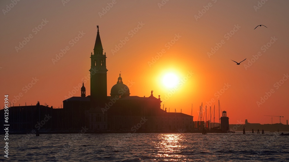 Silhouette shot of a building and a tower located on San Giorgio Maggiore island