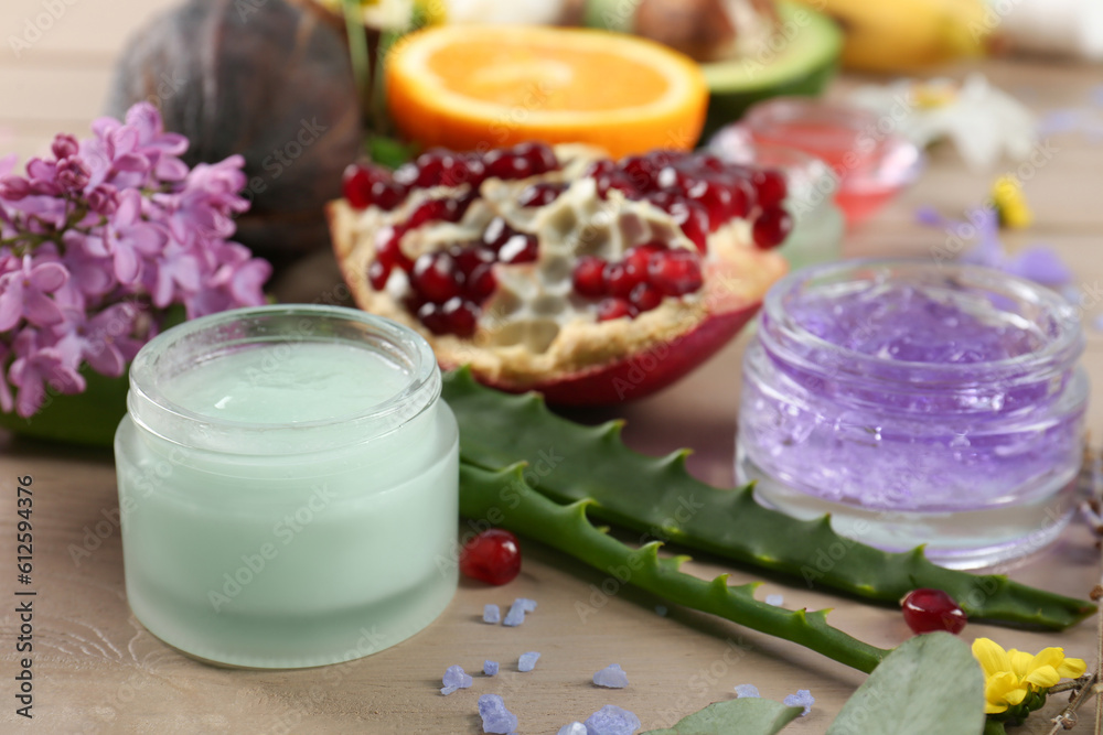 Homemade cosmetic products and fresh ingredients on wooden table, closeup. DIY beauty recipe Homemade cosmetic products and fresh ingredients on wooden table, closeup. DIY beauty recipe