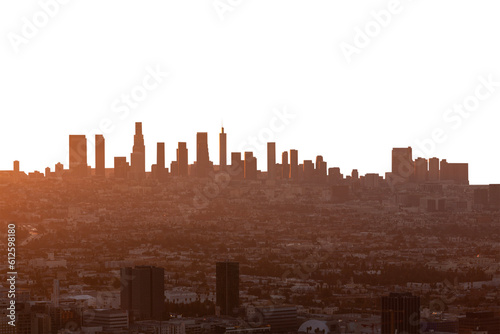 Fototapeta Smoggy orange sunrise cityscape view of Los Angeles and Hollywood from hilltop in the Santa Monica Mountains