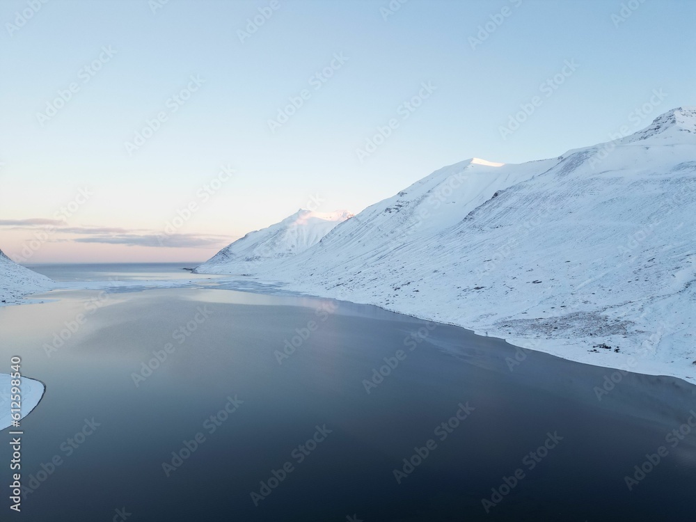 Drone view over a beautiful fjord landscape in winter in the north of Iceland Drone view over a beautiful fjord landscape in winter in the north of Iceland