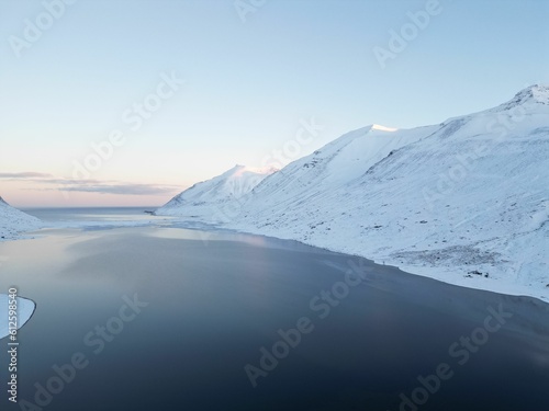 Drone view over a beautiful fjord landscape in winter in the north of Iceland © Lukas Hartmann/Wirestock Creators
