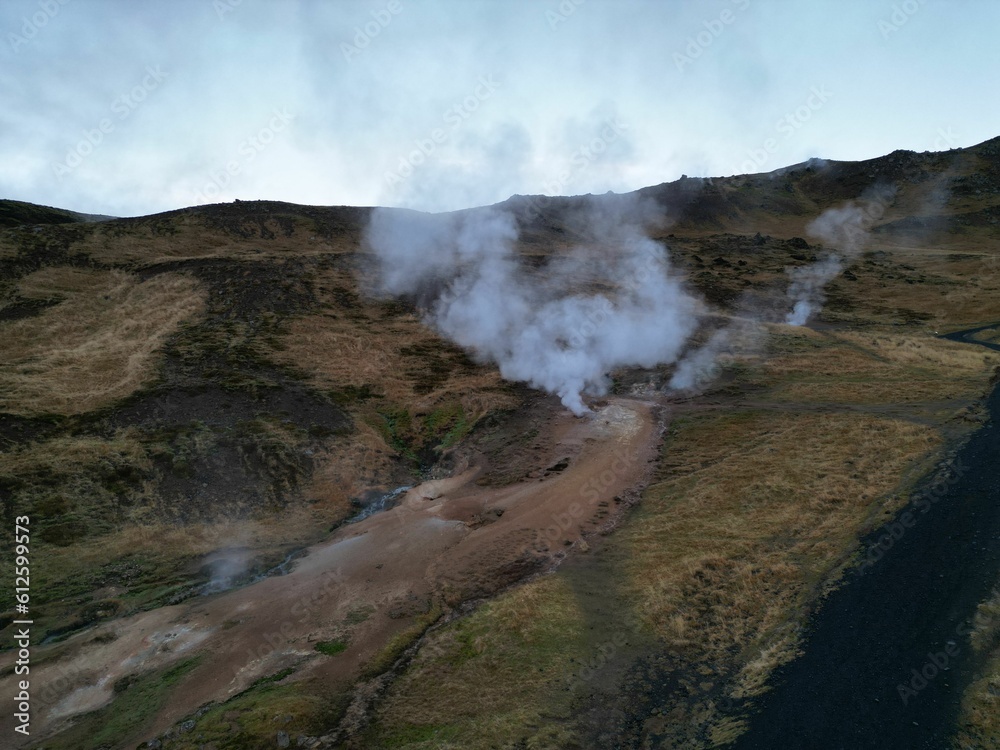 Bird's eye view of the steam coming out of the ground at Reykjadalur Hot Spring in Iceland