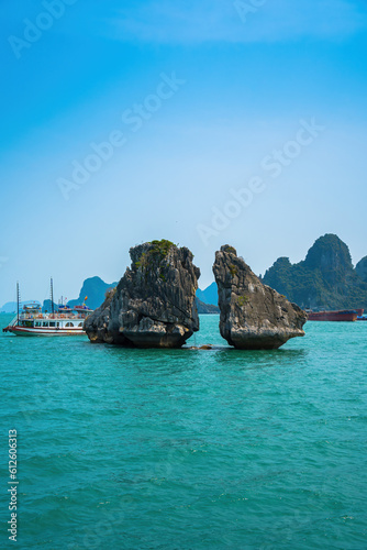 Hon Ga Choi Island or Cock and Hen, Fighting Cocks Island located in Halong bay, Vietnam, Trong Mai island, Southeast Asia, Junk boat cruise Ha Long Bay, Popular landmark, famous destination Vietnam. photo