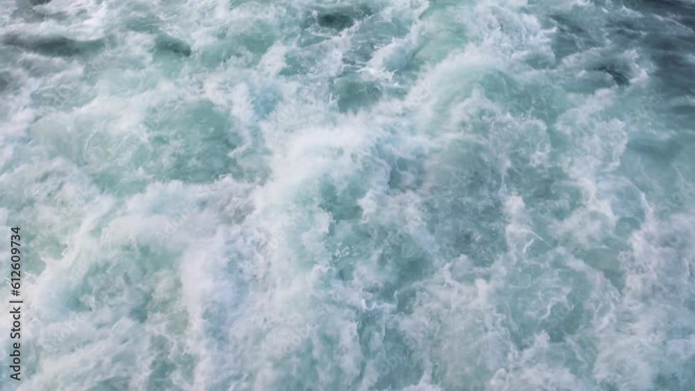 Close-up footprint, wave from boat, ship. Rafting, kayaking on mountain furious rivers over. Water active sports, raging elements, waterfall gorge with foam, bubbling. Texture of wild element of sea Close-up footprint, wave from boat, ship. Rafting, kayaking on mountain furious rivers over. Water active sports, raging elements, waterfall gorge with foam, bubbling. Texture of wild element of sea