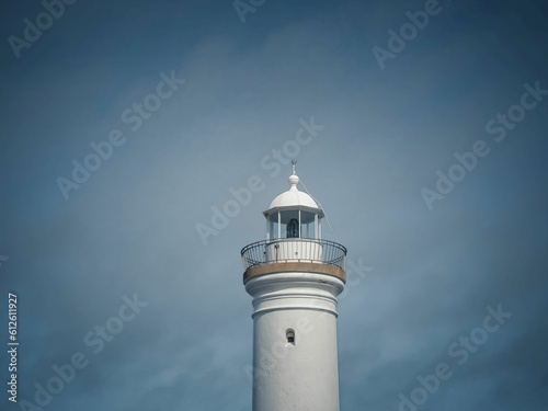 Low angle shot of a white lighthouse in a blue sky in Kiama, Australia