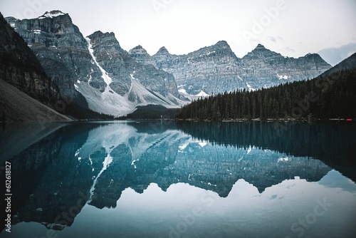 Fototapeta Naklejka Na Ścianę i Meble -  Beautiful view of Moraine lake with a reflection of snow covered mountain range