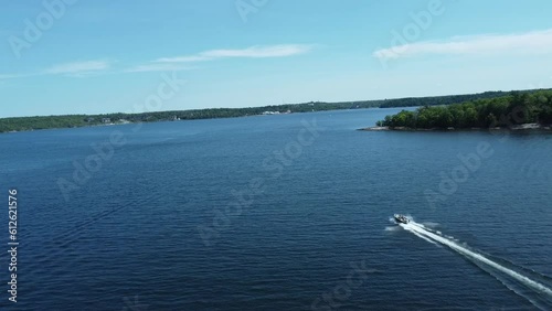 Wallpaper Mural High angle view of a single boat in the the blue water sea. Torontodigital.ca