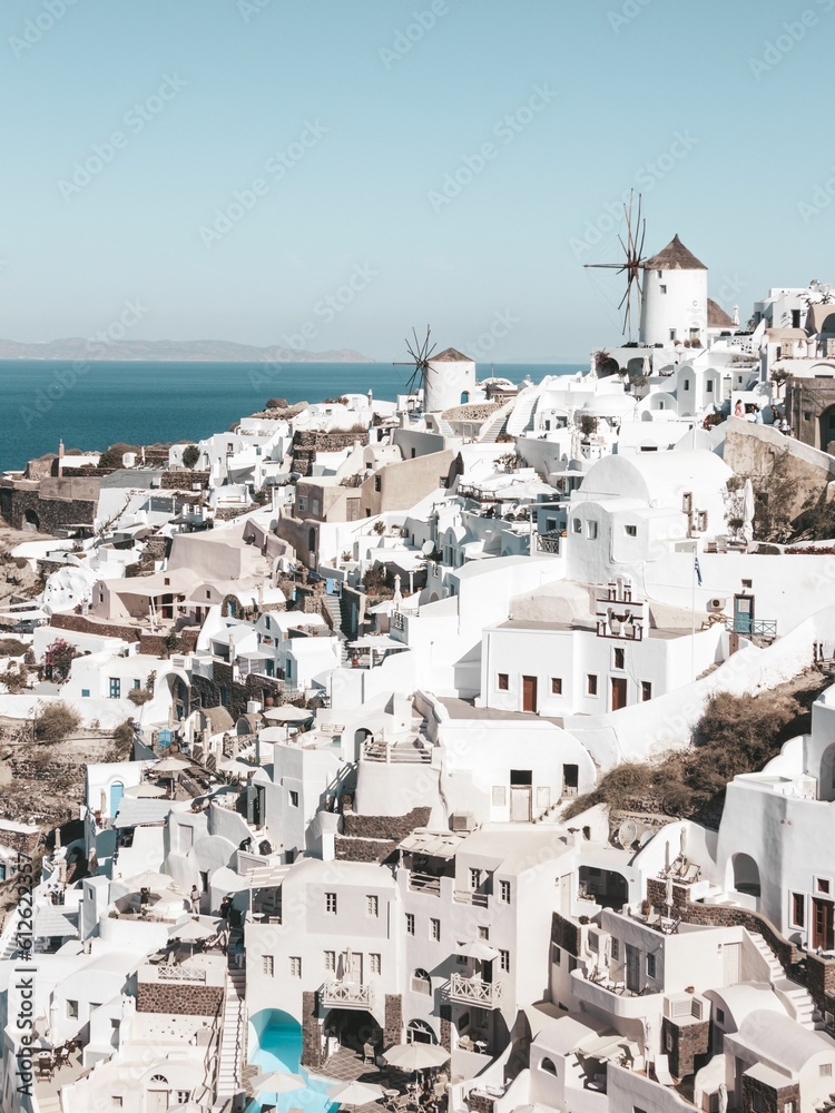 Beautiful cityscape of the white buildings of Santorini under the clear blue sky in Greece
