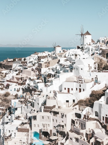 Beautiful cityscape of the white buildings of Santorini under the clear blue sky in Greece © Stephanie Photography/Wirestock Creators