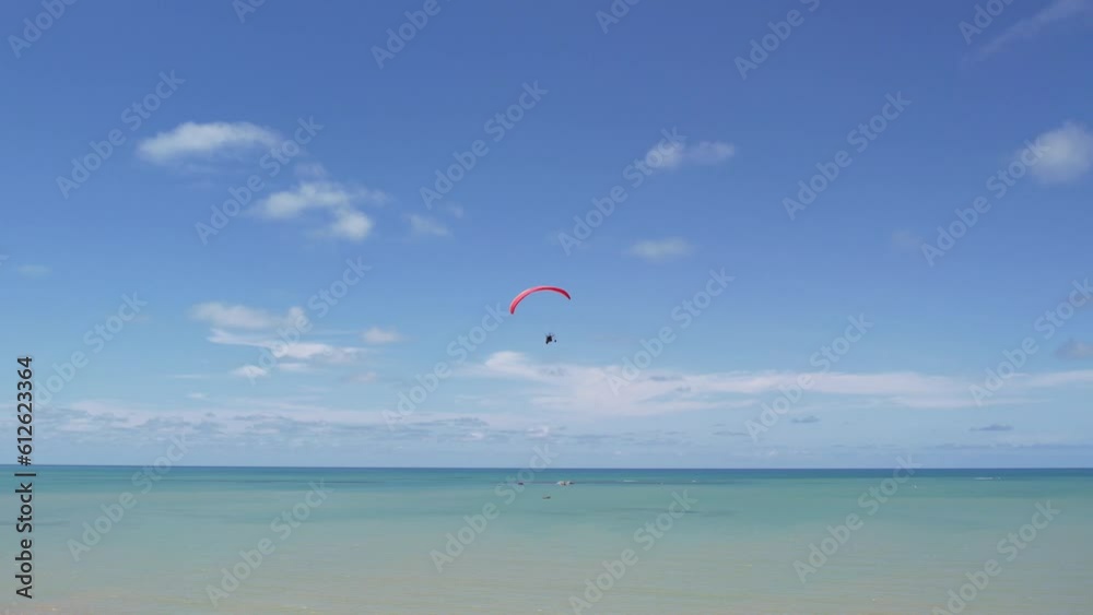 Beautiful view of a parachute flying over the ocean Beautiful view of a parachute flying over the ocean