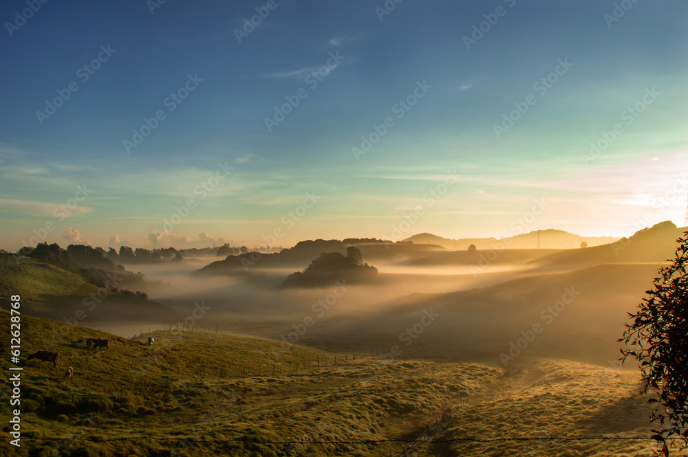Fototapeta premium foggy fields and blue sky