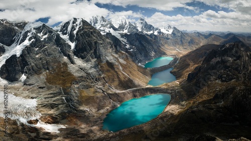 Huayhuash Mountain Range over the azure lagoons in Peru