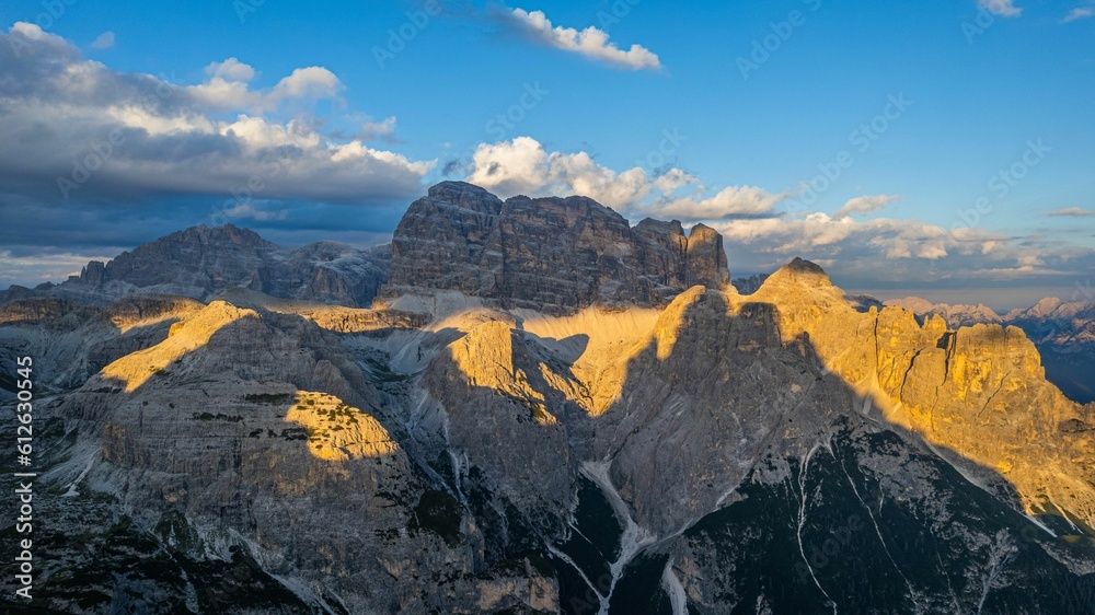 Obraz premium Winter Tre Cime di Lavaredo mountain view at sunrise, shiny sun and clear sky background