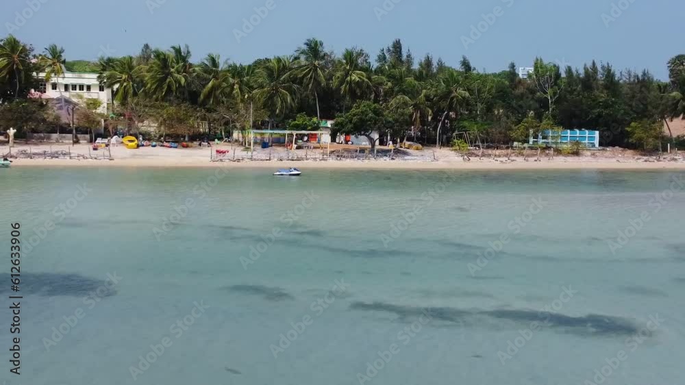 Aerial video of the crystal clear sea and palm trees on the beach Aerial video of the crystal clear sea and palm trees on the beach