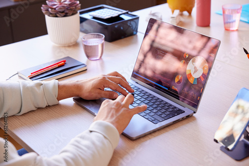 Cropped image of IT specialist writing program code on laptop
