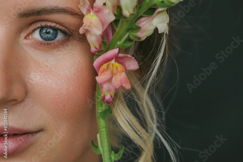 half face beauty portrait of pretty woman with natural make up  photo