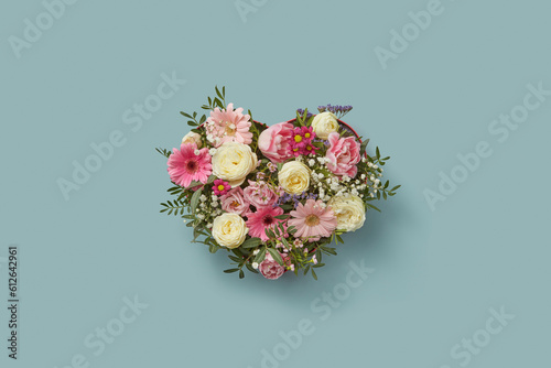 Beautiful bouquet in heart-shaped box. photo