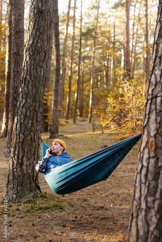 Hammock getaway connection phone call woodland environment rest