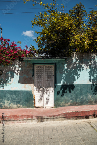 Colorful facade of colonial house in Mexico photo