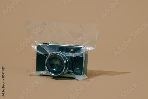 old camera vacuum packed in a vacuum bag  photo