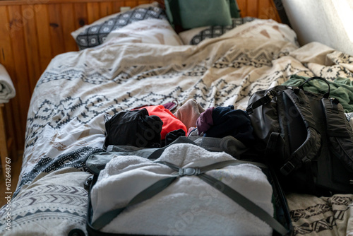 Holidays suitcase on top of bed photo