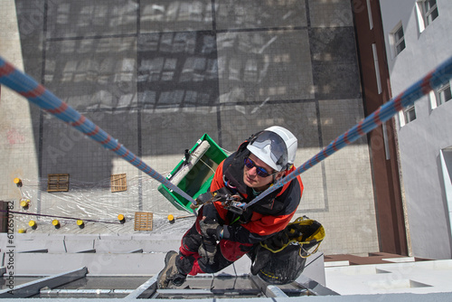 Rope access. Cleaning the windows of the skyscraper.