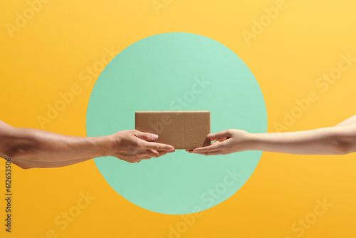Delivery service. Two people hands handing the delivered