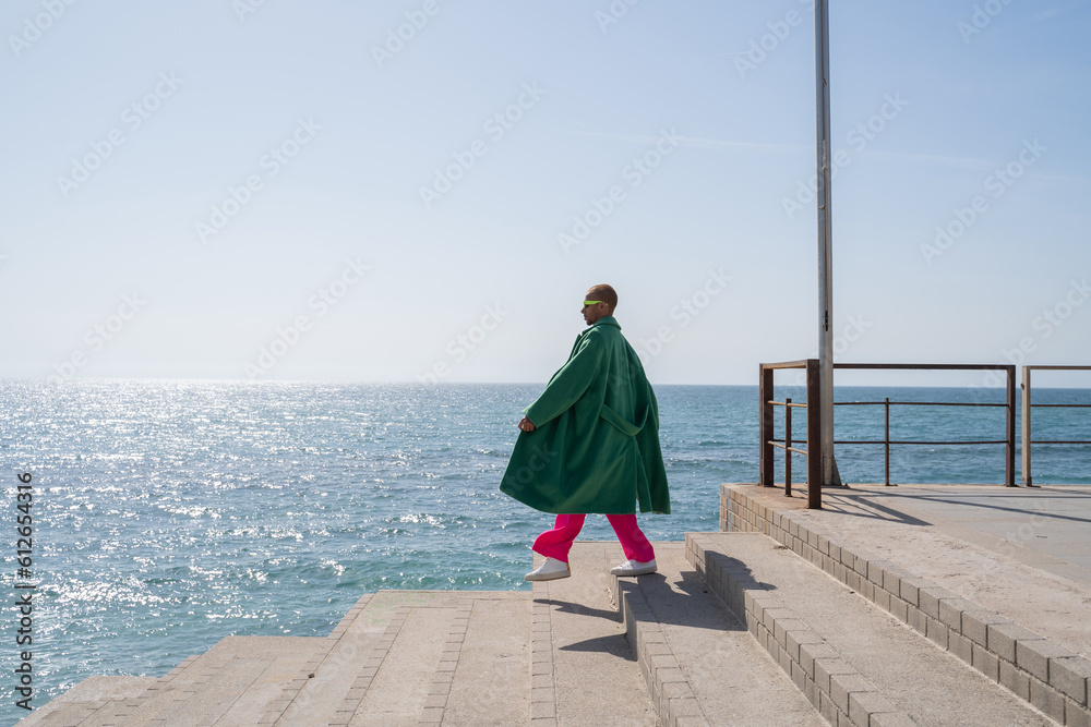 © Alba Vitta/Stocksy - Fashion man by the sea