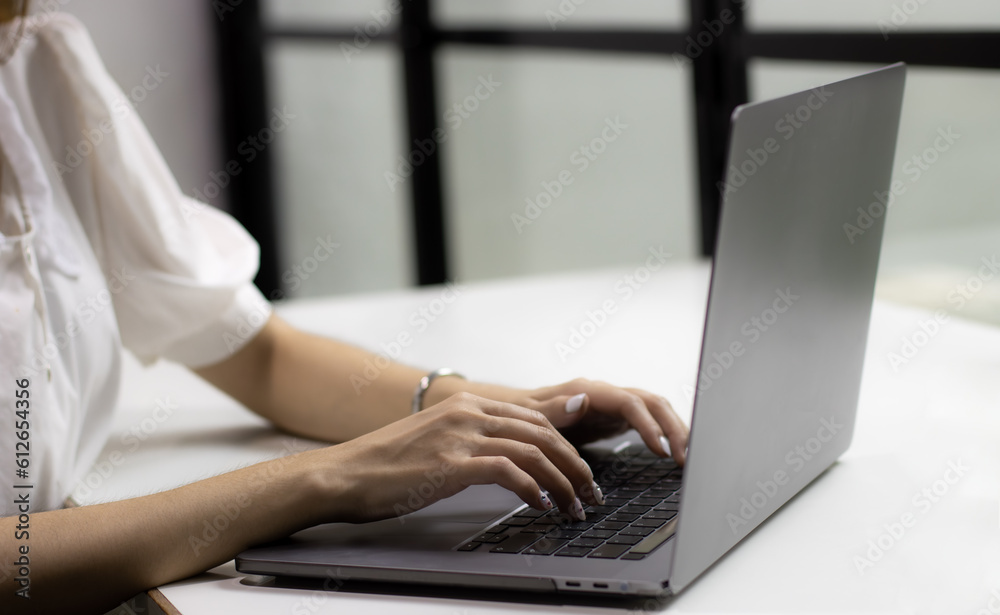 Woman using laptop computer working at home. Technology and business concept. Woman using laptop computer working at home. Technology and business concept.
