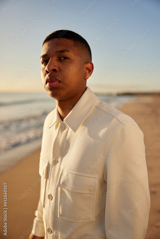 Serious man in stylish outfit on beach Serious man in stylish outfit on beach