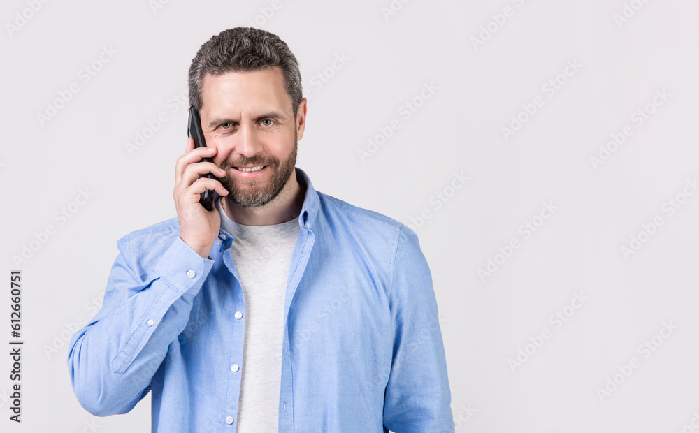 man has communication call on phone isolated on studio background with copy space. man has communication call on phone isolated on studio background with copy space.