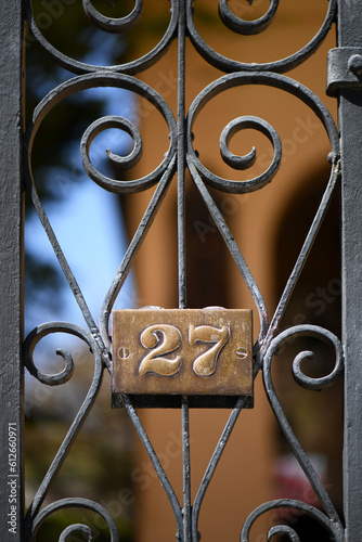 An Iron Gate With Number 27 In Charleston, South Carolina photo