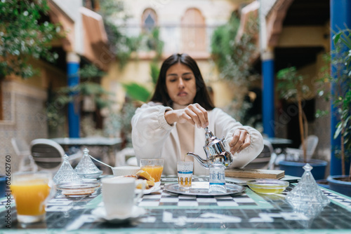 Woman having breakfast in riad photo