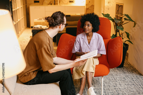 A woman communicates at a consultation in an interior design studio photo