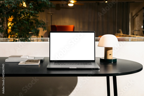 Wallpaper Mural Laptop mockup on the table in the design studio Torontodigital.ca