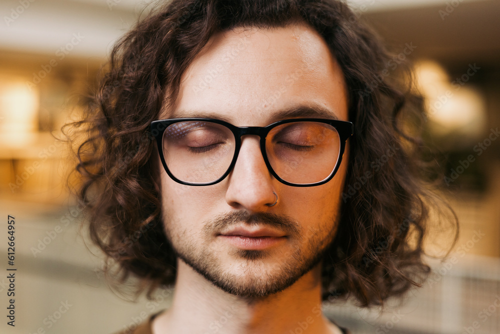 Portrait of a young man with glasses and closed eyes Portrait of a young man with glasses and closed eyes