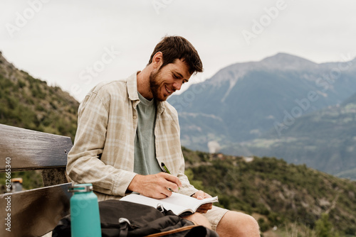 Man write on notebook photo