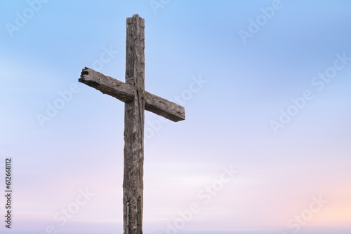 Wooden cross against a setting pastel sky in Ventura California photo