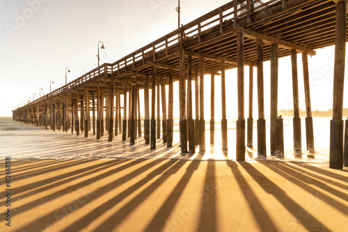 Sunset through wood pier Ventura California photo