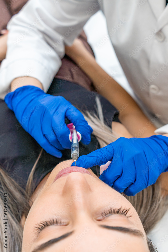 doctor injecting facial and lip treatment doctor injecting facial and lip treatment