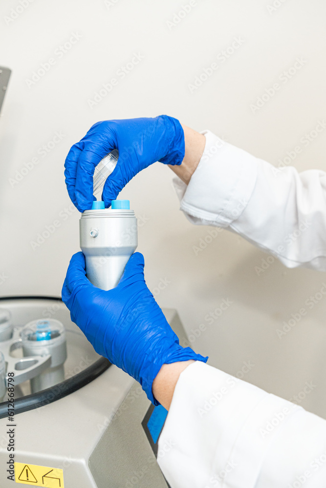 © Alvaro Lavin/Stocksy - doctor using blood centrifuge machine to obtain plasma