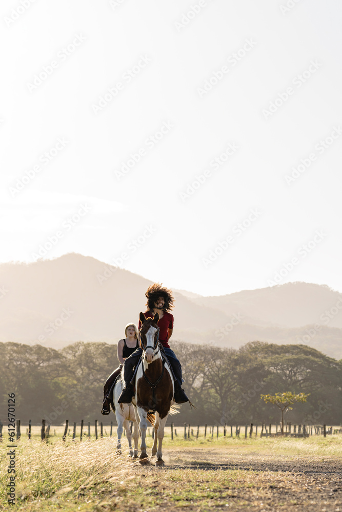 Image of a couple riding a horse. Image of a couple riding a horse.