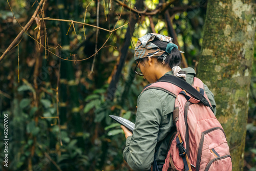 Girl biologist in the jungle photo