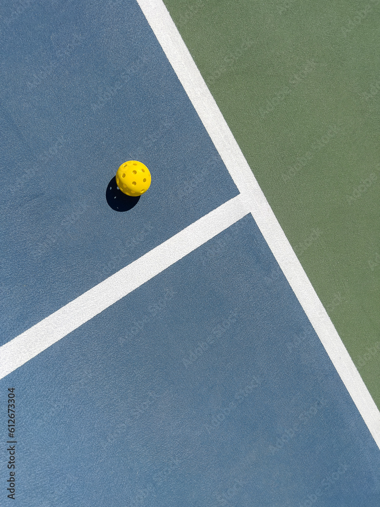 Pickleball court background texture with lone ball and lines Stock