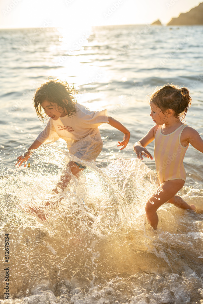 Kids running in the water Kids running in the water