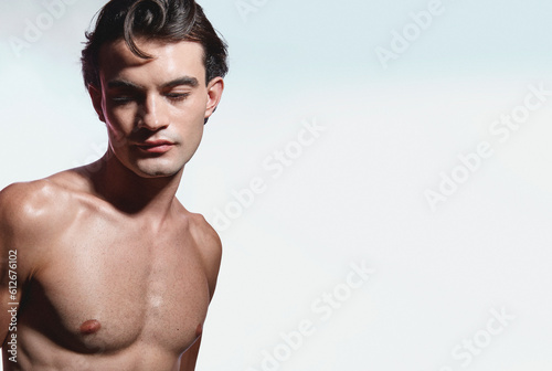 A youthful gentleman with a well-defined physique and radiant skin.