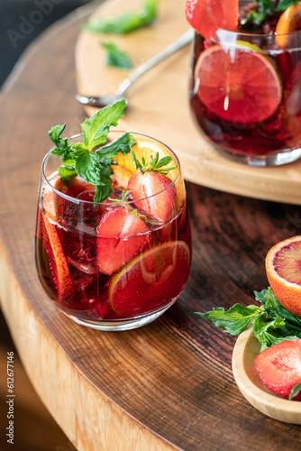 Refreshing Red Sangria decorated with oranges, strawberries, mint