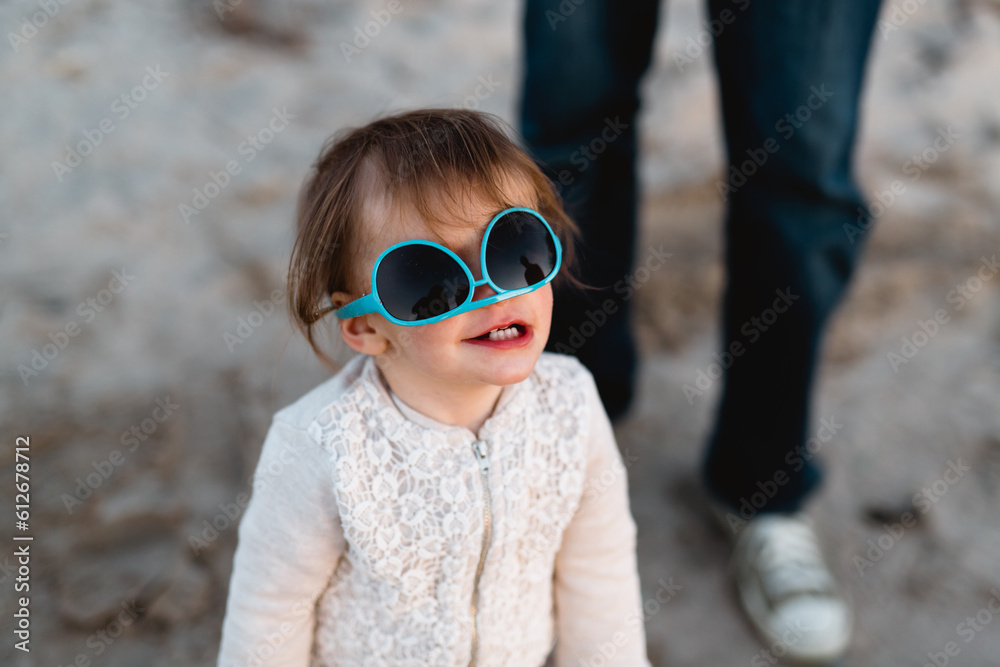 Little girl wears sunglasses upside down Stock Photo Adobe Stock
